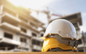 Hard hats at a construction site supported by the construction standard of care