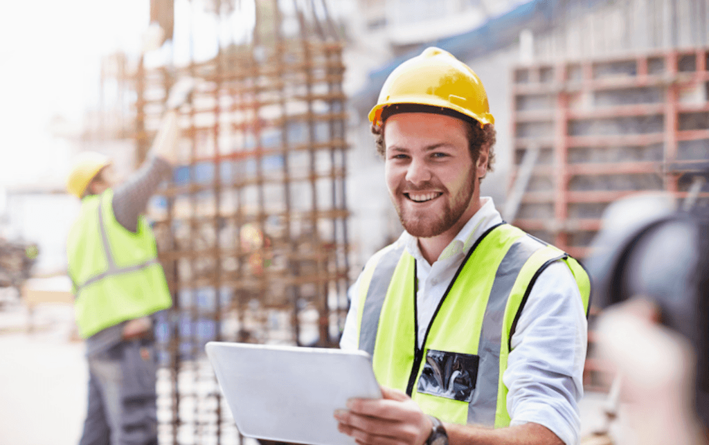 Construction worker smiling after advancing in his career through continuing education