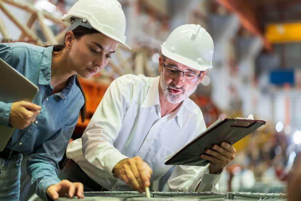 Construction professional providing training to a construction management student