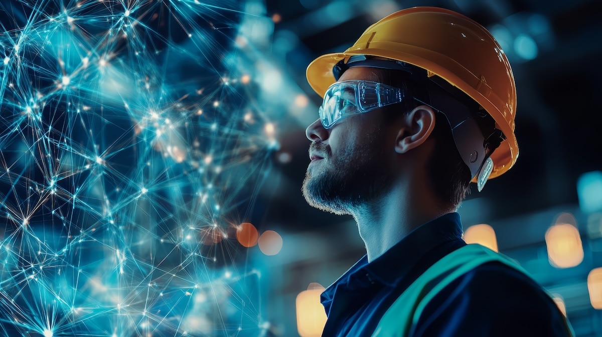 Construction worker using advanced technology to review project status