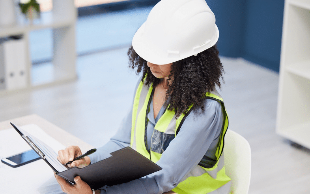 Construction instructor reviewing information in a school setting